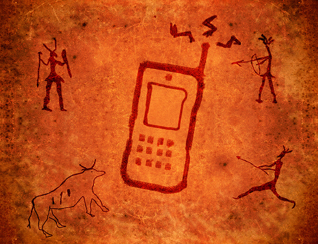 Image of a cell phone in the middle of drawings on a stone